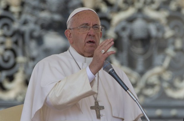 Pope Francis delivers his blessing during his weekly general audience, in St. Peter's Square, at the Vatican, Wednesday, April 15, 2015.
