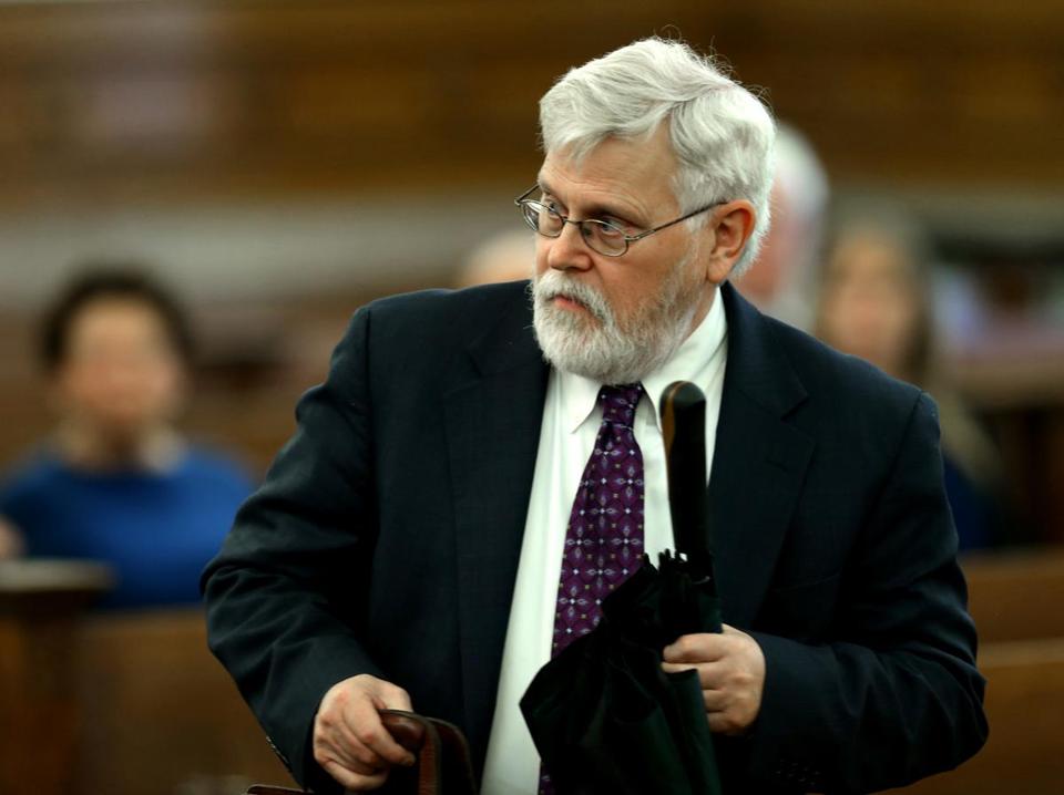 Rabbi Barry Starr prepared to leave his arraignment at Norfolk Superior Court Tuesday.