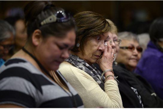 Residential school survivors and aboriginal women react as Truth and Reconciliation Commission chairman Justice Murray Sinclair speaks.