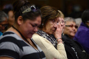 Residential school survivors and aboriginal women react as Truth and Reconciliation Commission Chair Murray Sinclair speaks at the release of the commission's report Tuesday. (Adrian Wyld/The Canadian Press)