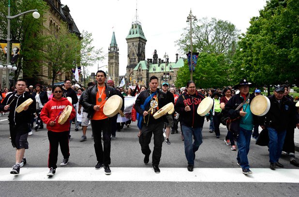 First Nations drummers march on Parliament Hill to lead the May 31 Walk for Reconciliation.