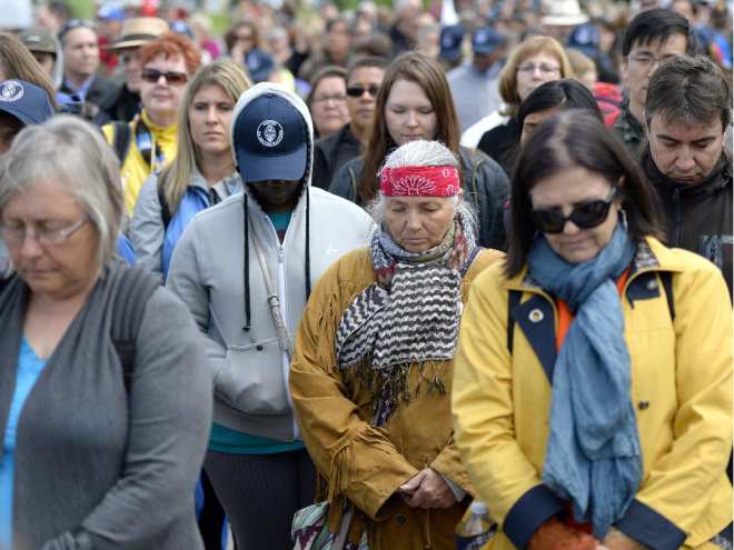 People gather before the Walk for Reconciliation, part of the closing events of the Truth and Reconciliation Commission on Sunday, May 31, 2015 in Ottawa.