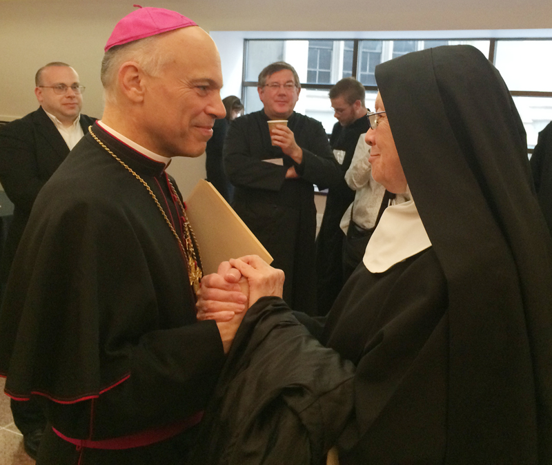 San Francisco Archbishop Salvatore Cordileone speaks with a nun Wednesday (June 3) after his talk, in which he criticized “gender ideology” as a threat to society and the church. Religion News Service photo by David Gibson