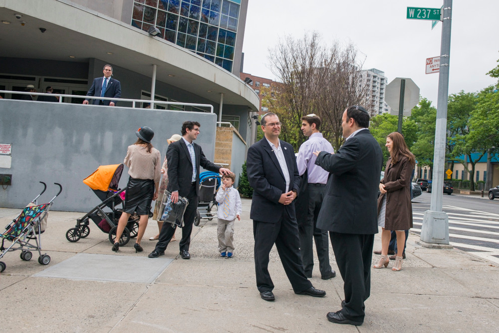 Members of the Riverdale Jewish Center in front of the building on Saturday afternoon.