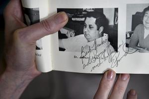 Linette Gavin shows a photo of Edmund Frost in her 1974 Regina High School yearbook, which he signed, Best wishes and prayers for much happiness. More than 30 years later, church officials acknowledged that abuse claims against Frost from the 1970s were credible. (Pioneer Press: Jean Pieri)