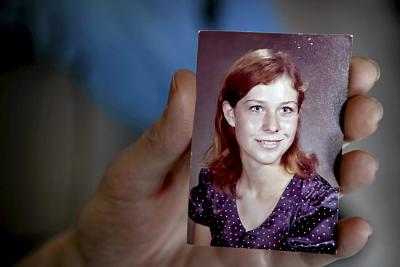 Linette Gavin shows a school picture of herself at age 14, last week at her Maplewood home. Gavin was kidnapped and raped in 1972, when she was 15. (Pioneer Press: Jean Pieri)