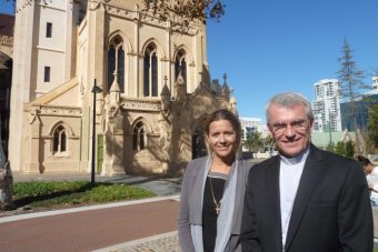 PHOTO: Safeguarding project coordinator Andrea Musulin with Perth Archbishop Timothy Costelloe. (ABC News: Natasha Harradine)