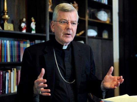 FILE - In this July 30, 2014, file photo, St. Paul-Minneapolis Archbishop John Nienstedt speaks at his office in St. Paul, Minn. On Monday, June 15, 2015, the Vatican said Pope Francis accepted the resignations of Nienstedt and Auxiliary Bishop Lee Anthony Piche after prosecutors charged the archdiocese with having failed to protect children from unspeakable harm from a pedophile priest.