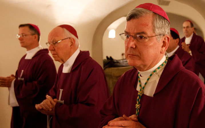 Archbishop John C. Nienstedt of St. Paul and Minneapolis, right, and other bishops from Minnesota, North Dakota, and South Dakota concelebrated Mass at the Altar of the Tomb in the crypt of St. Peter’s Basilica during their “ad limina” visits to the Vatican in 2012. (CNS photo/Paul Haring)