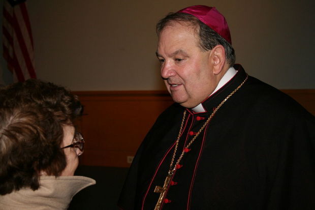 Archbishop Bernard Hebda speaks to a woman at his Welcome Mass at Cathedral Basilica of the Sacred Heart in Newark on Nov. 5, 2013. (File photo)