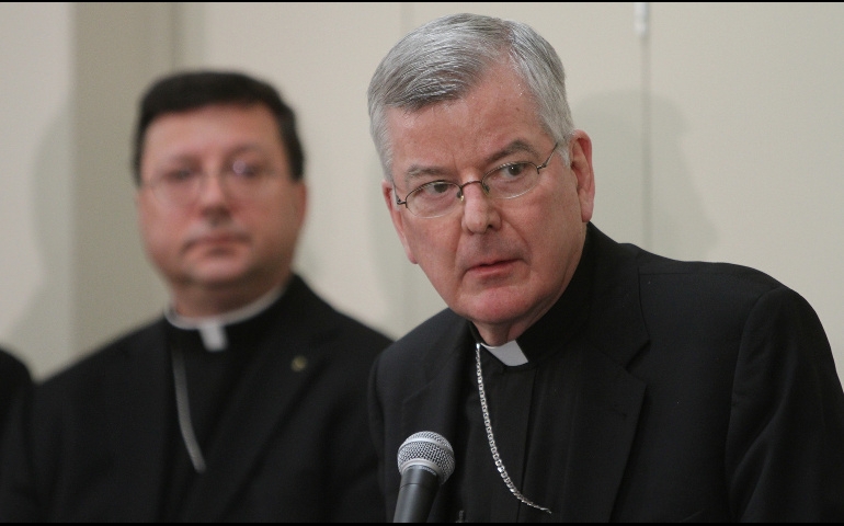 Archbishop John C. Nienstedt, right, addresses the media alongside Auxiliary Bishop Lee A. Piche at a news conference Jan. 16 announcing that the archdiocese had filed for Chapter 11 Reorganization. (CNS/Dave Hrbacek)