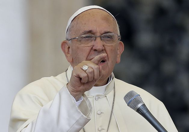Pope Francis delivers his message on the occasion of an audience with participants of Rome's diocese convention in St. Peter's Square, at the Vatican, Sunday, June 14, 2015. Francis engaged in some self-promotion during his weekly blessing, alerting the thousands of people in St. Peter's Square that his first solo encyclical is coming out on Thursday and inviting them to pay attention to environmental degradation around them. Photo: Gregorio Borgia, AP