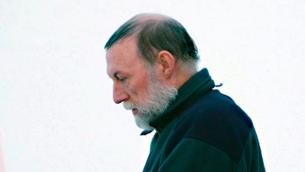 Catholic priest Eric Dejaeger leaves an Iqaluit, Nunavut, courtroom on Jan. 20, 2011 after his first appearance for six child sexual abuse charges in Igloolik dating back to the 1970s. Dejaeger, who was sentenced to 19 years, was back in Iqaluit court Tuesday for an update on three outstanding sex charges that date back to his time in an Alberta college in the mid-1970s. (Chris Windeyer/The Canadian Press)