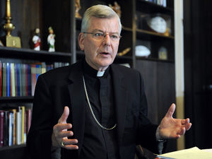 In this July 30 photo, Archbishop John Nienstedt talks with a reporter at his office in St. Paul. The Archdiocese of St. Paul and Minneapolis reported a $9.1 million operating deficit for fiscal year 2014.