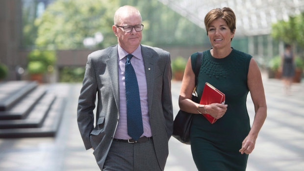 Former Vancouver Olympics CEO John Furlong and Renee Smith-Valade leave B.C. Supreme Court in Vancouver on June 15 2015. (Jonathan Hayward / THE CANADIAN PRESS)