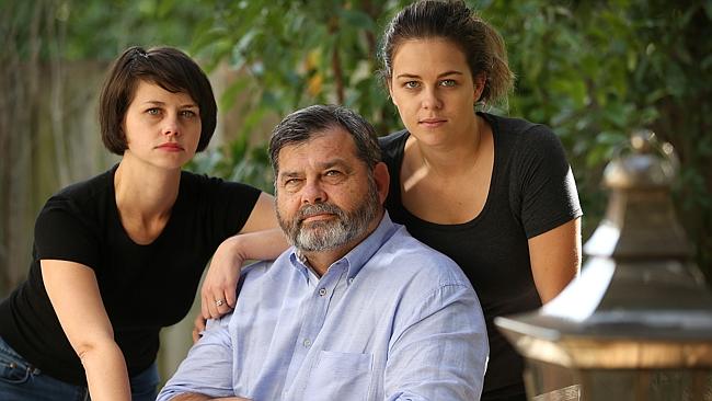 Chief Justice Tim Carmody with daughters Claire and Tess. Carmody knows more about child protection than any other judge in the state.