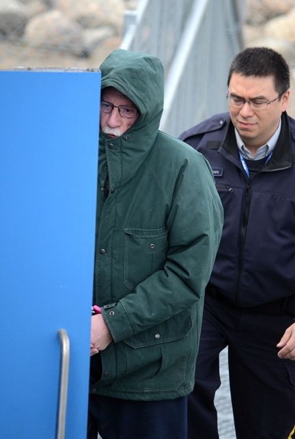 Eric Dejaeger is escorted by RCMP into the Nunavut Court of Justice building June 18. (PHOTO BY DAVID MURPHY)