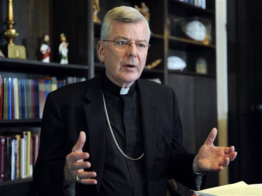 FILE - In this July 30, 2014, file photo, St. Paul-Minneapolis Archbishop John Nienstedt speaks at his office in St. Paul, Minn. On Monday, June 15, 2015, the Vatican said Pope Francis accepted the resignations of Nienstedt and Auxiliary Bishop Lee Anthony Piche after prosecutors charged the archdiocese with having failed to protect children from unspeakable harm from a pedophile priest. Nienstedt, interfered with an investigation by an outside law firm into allegations of his misconduct, Minnesota Public Radio reported Friday, June 19, 2015. CRAIG LASSIG, FILE — AP Photo Vatican Church Abuse