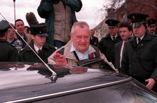 Brendan Smyth is surrounded by RUC officers as he leaves Limavady Courthouse in 1997