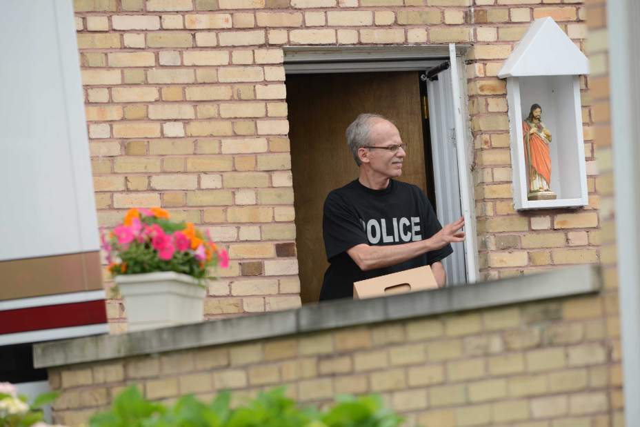 An investigator with the state Attorney General's Office collects evidence at the St. Bernardine Monastery in Hollidaysburg on Thursday, June 25, 2015.