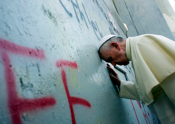 Francis at Israel’s concrete barrier separating Bethlehem from Jerusalem.