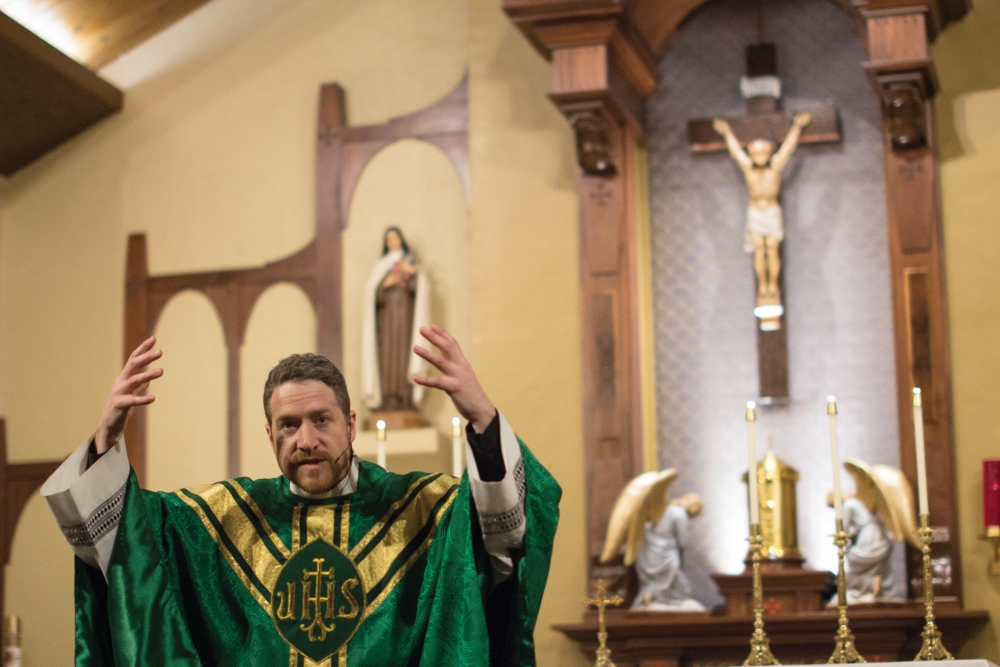 Fr. Denis Heames preaches his homily on Sunday, Feb. 1, 2015 at St. Marys University Parish.