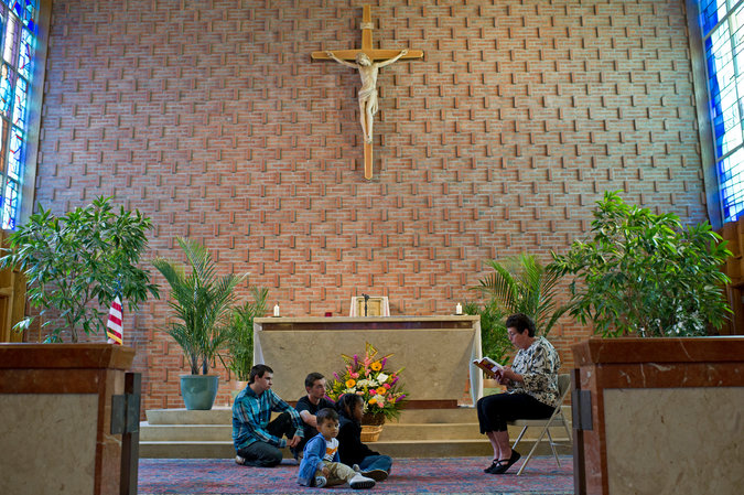 Patti Litz, right, with from left, Christian and Scott Arnold, Jase Alves and Jayla Daveiga, at St. Frances Xavier Cabrini Church in Scituate, Mass.