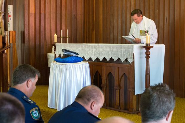 Former Sawtell parish priest Father John Casey performing at a Police Remembrance day service at Sawtell's Mary Help of Christians church.