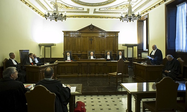 Members of the court and lawyers at the opening of Jozef Wesolowski’s trial in the Vatican. Photograph: Osservatore Romano/Reuters