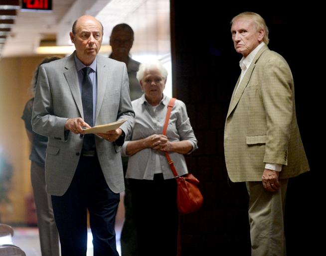 VineLife Church Pastor Robert Young, left, and elder Warren Williams walk to the courtroom in the Boulder County Justice Center on Thursday before their sentencing hearing. The two church officials pleaded no contest to failing to report child abuse. Young was sentenced to 10 days in jail or on a work crew, while Williams must serve 40 hours of community service. Both also were sentenced to one year of probation. (Cliff Grassmick / Staff Photographer)