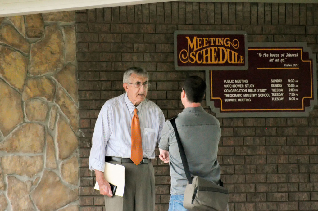Reveal reporter Trey Bundy (right) talks to Debbie McDaniel’s father, Wendell Marley, who is an elder in McAlester’s congregation of Jehovah’s Witnesses. He said he wanted nothing to do with McDaniel and her “immoral lifestyle.”