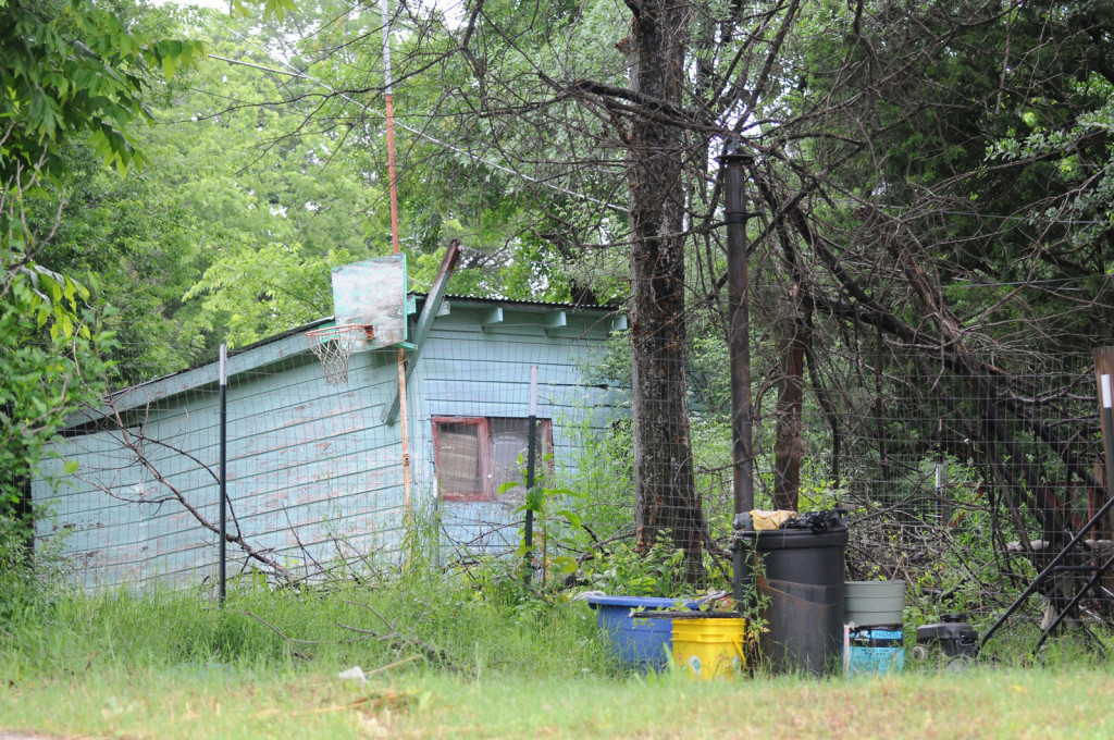 An aboveground pool once stood near this shack in the backyard of elder Ronald Lawrence’s former home. In the 1970s and ’80s, Debbie McDaniel said, Lawrence hosted pool parties here for local Witness children.