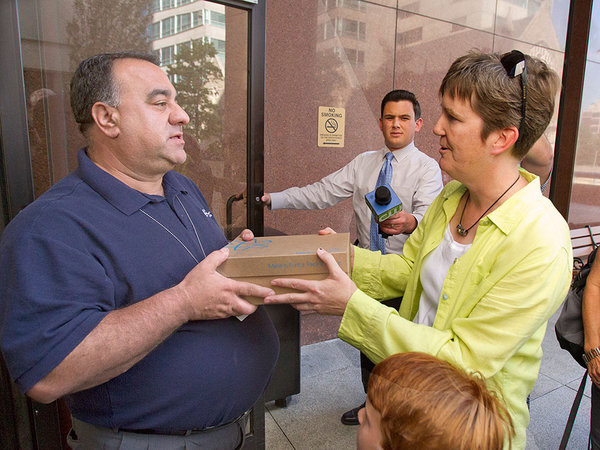 Former Waldron Mercy Academy teacher Margie Winters was not allowed in the building, but an archdiocesan representative accepted the box of signed petitions. CHARLES FOX / Staff Photographer