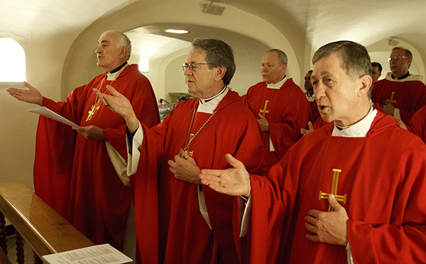 Blase J. Cupich of Spokane, Wash., far right, concelebrates Mass in 2012 with other U.S. bishops in the crypt of St. Peter’s Basilica at the Vatican. Photo by Paul Haring, courtesy of Catholic News Service