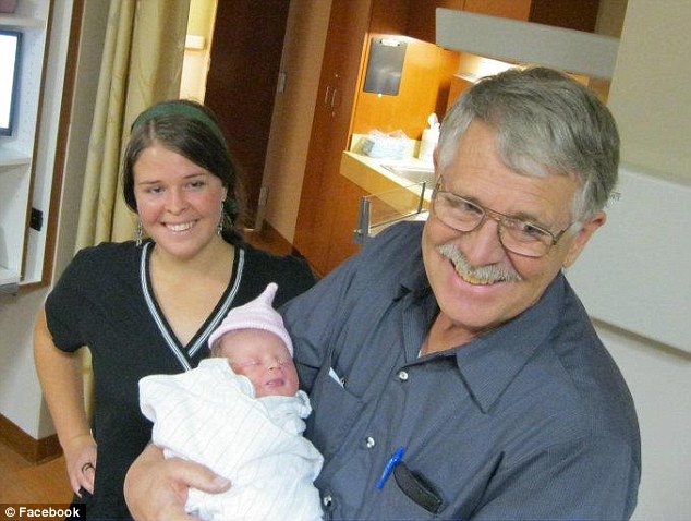 Imprisonment: Kayla pictured above with her father Carl, celebrating a new baby, in a picture posted to Facebook before her death. The new details about Kayla's abuse discredit previous reports that she had willingly married a member of the terrorist organization