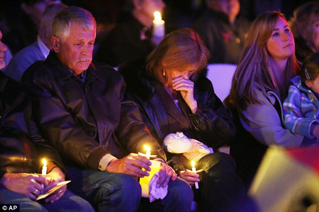 Incredible loss: On February 10, ISIS announced that Kayla had been killed in a coalition airstrike, though the Pentagon maintains that she was murdered by her own captors. Her parents Carl and Marsha Mueller pictured mourning their daughter's loss at a memorial on February 18