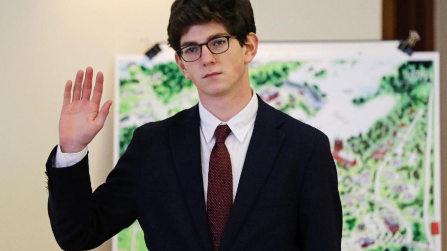 FILE - In this Aug. 26, 2015, file photo, St. Paul's School graduate Owen Labrie, 19, raises his hand to be sworn-in prior to testifying in his trial at Merrimack Superior Court in Concord, N.H. Labrie was convicted Friday, Aug. 28, 2015, of having sexual contact with a 15-year-old classmate. He will be required to register as a sex offender for life, a punishment his lawyer likened to being branded and legal experts and reform advocates said exceeds the crime. (AP Photo/Charles Krupa, Pool, File) (The Associated Press)