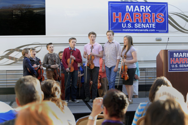 Children from the Duggar family sing during Rev. Mark Harris's Republican U.S. Senate campaign in 2014.