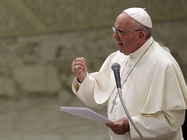 Pope Francis delivers his message during an audience with faithful and employees of the Rome's Cooperative Credit Bank in the Paul VI hall at the Vatican, Saturday, Sept. 12, 2015. (AP Photo/Gregorio Borgia)