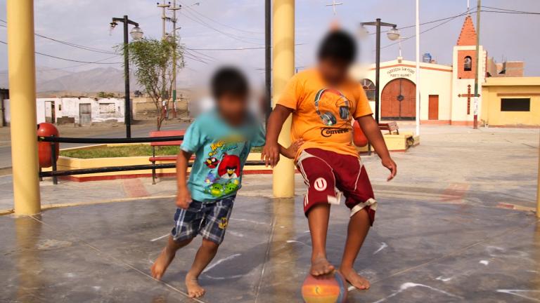 Children play soccer in front of the church where Father Paul Madden celebrates Mass, in the tiny, scruffy fishing village of Puerto Huarmey, Peru. Father Madden admitted to molesting a 13-year-old boy, and told GlobalPost he could never again work in the US.