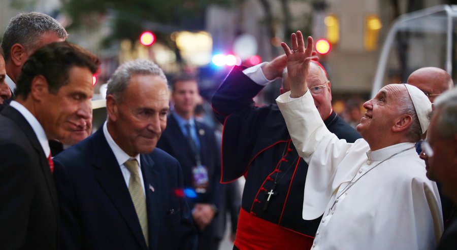 Pope Francis waves to the crowd as he arrives at St. Patrick's Cathedral, Thursday, Sept. 24, 2015, in New York. New York Gov. Andrew Cuomo, left, and Sen. Chuck Schumer, D-NY, wait to greet the pope. (Damon Winter/The New York Times via AP, Pool) The Associated Press