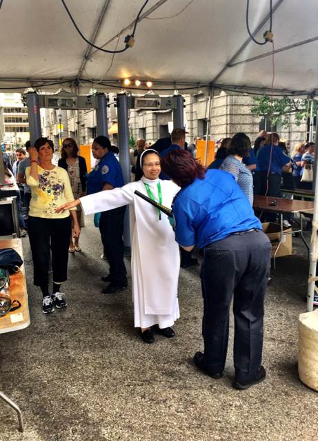 A nun is checked by a TSA agent in Philadelphia Saturday. Elyse Perlmutter-Gumbiner / NBC News
