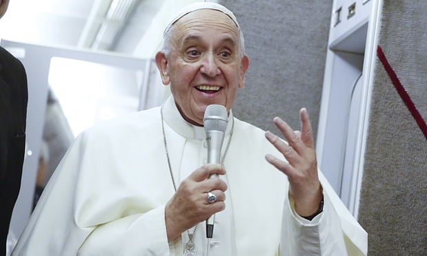Pope Francis talks to journalists during a press conference while en route to Rome at the end of his trip to Cuba and the United States. Photograph: Tony Gentile/AP