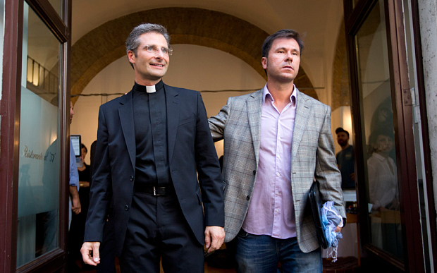 Monsignor Krzysztof Charamsa, left, and his boyfriend Eduard in central Rome Photo: Alessandra Tarantino/AP