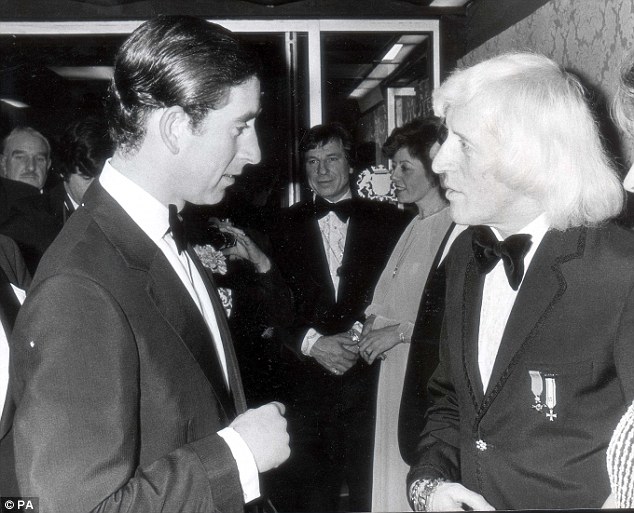 Prince Charles is pictured meeting Jimmy Savile at a dinner event at the Club Double Diamond in Caerphilly in 1978