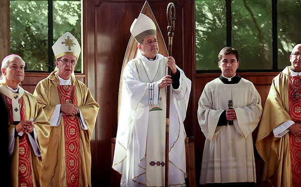Rev. Juan Barros, centre, attends his ordination ceremony as bishop in Osorno, southern Chile Photo: AP