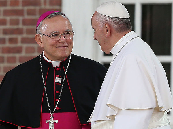 Archbishop Charles J. Chaput smiles at Pope Francis before he speaks at Independence Hall in Philadelphia on Sept. 26, 2015. (DAVID MAIALETTI/Staff Photographer)