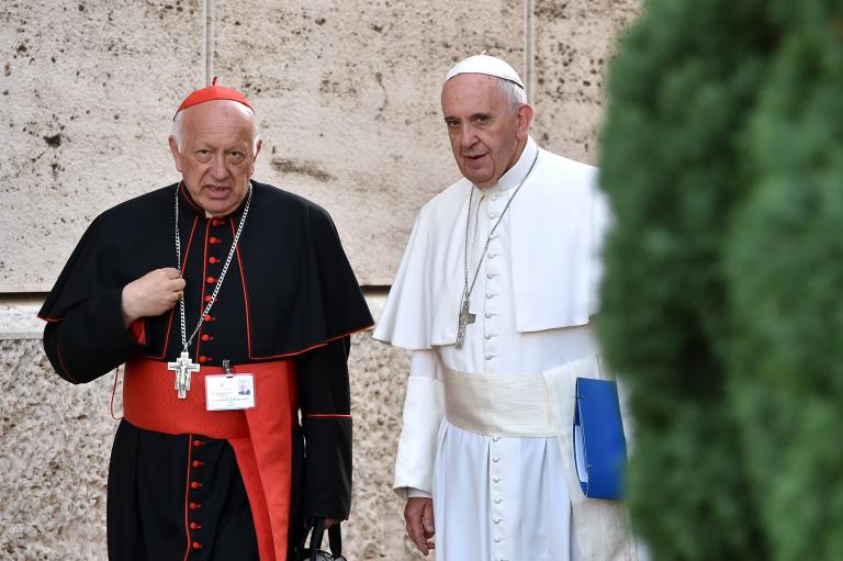 Pope Francis talks with Chilean cardinal Ricardo Ezzati Andrello as arrives for the Synod on the family, at the Vatican, on October 5, 2015.