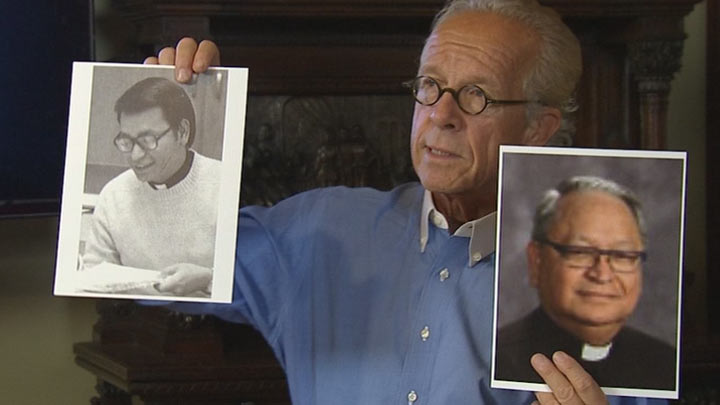 Attorney Jeff Anderson holds up photos of Rev. Antonio Marfori at a news conference announcing a lawsuit.