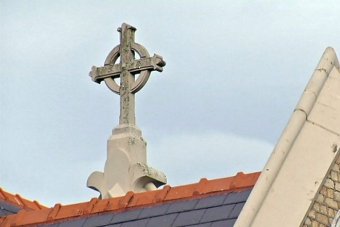 PHOTO: X marks the spot. The cross on the roof of Lismore's Anglican Church overlooks the site of the infamous former North Coast Children's home. (ABC News)